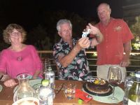 Dennis's birthday celebration 2023 at Cosmos Huatulco, with Carmel and Peter Jones. Dennis is in the center.